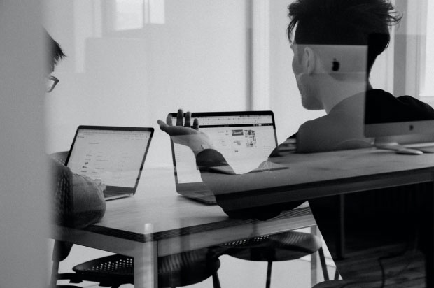 Person sitting by their computer.